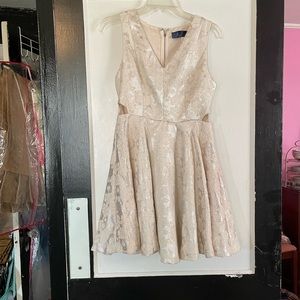 Cream colored, brocade fabric. Great wedding dress!